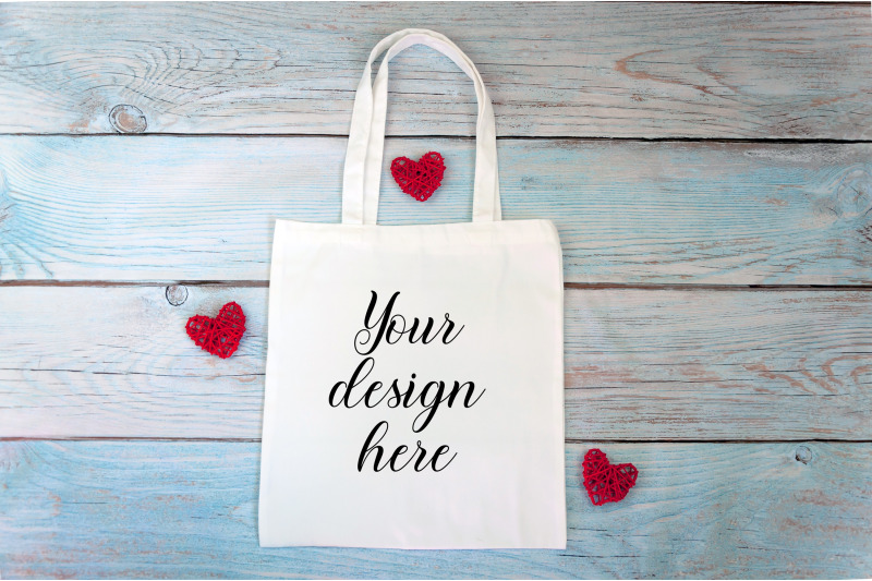 valentines-day-white-tote-bag-mockup-on-a-wooden-background