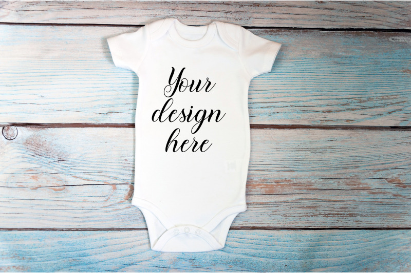 baby-bodysuit-mockup-with-toy-on-a-wooden-background