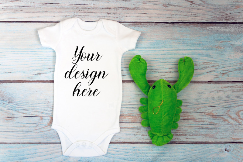 baby-bodysuit-mockup-with-toy-on-a-wooden-background