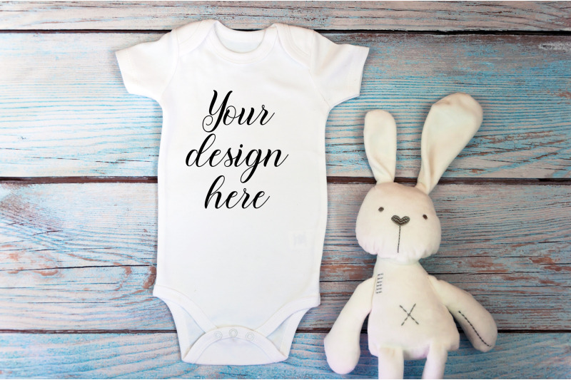 baby-bodysuit-mockup-with-toy-on-a-wooden-background