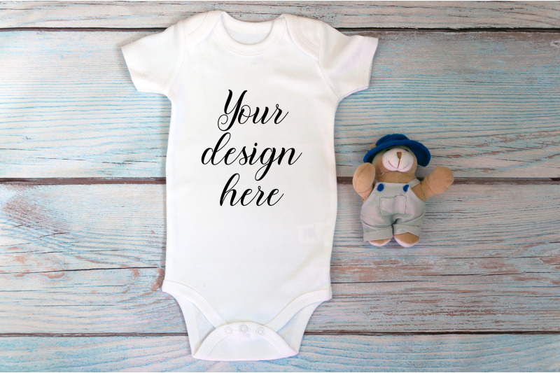 baby-bodysuit-mockup-with-toy-on-a-wooden-background