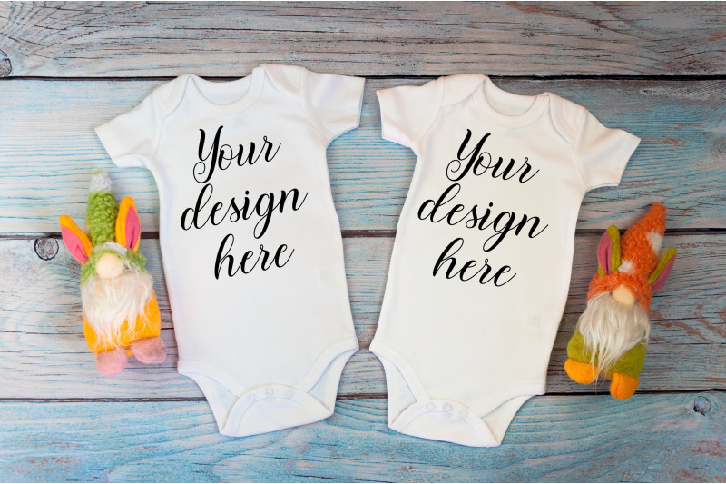 twin-baby-bodysuit-mockup-on-a-wooden-background
