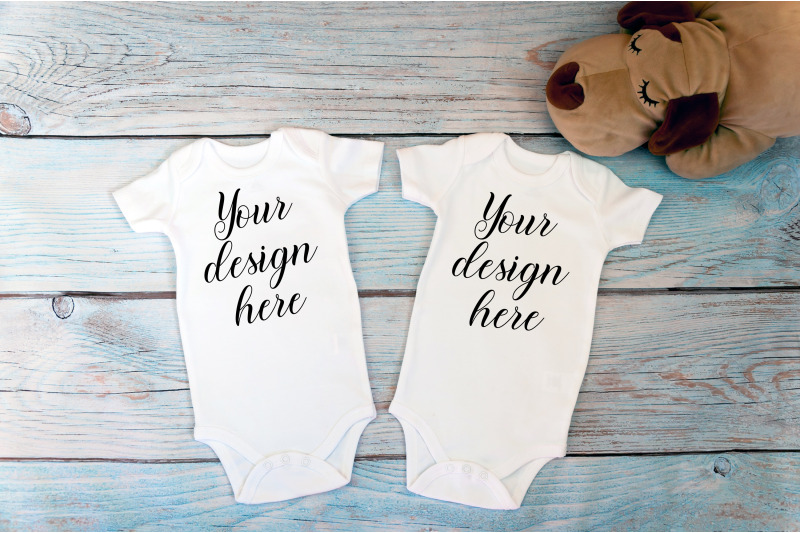 twin-baby-bodysuit-mockup-on-a-wooden-background