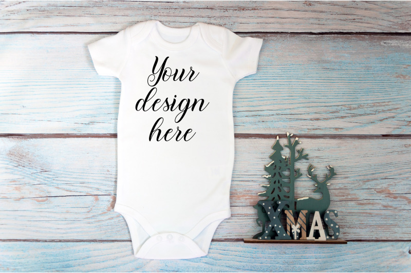 christmas-baby-bodysuit-mockup-on-a-wooden-background