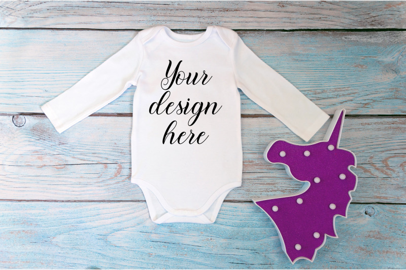 bodysuit-mockup-with-long-sleeves-on-a-wooden-background