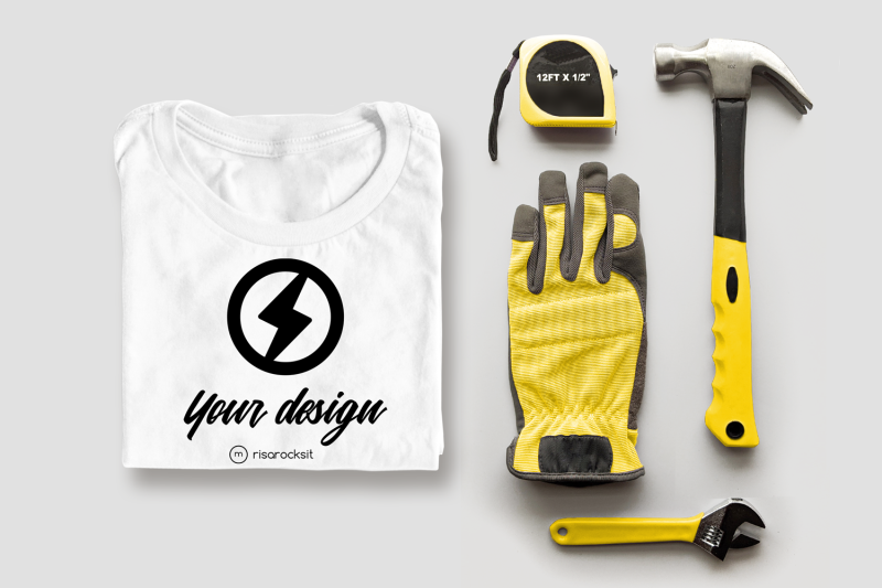 folded-tee-shirt-with-tools-png-mock-up