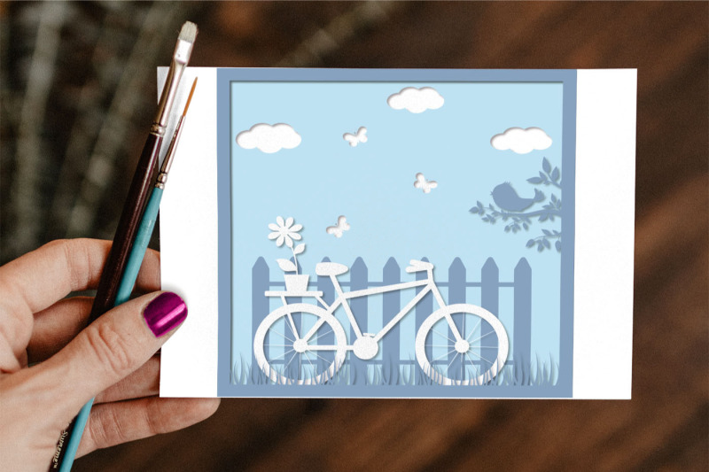 3d-paper-cut-out-bike-by-fence-multi-layer-shell-pattern