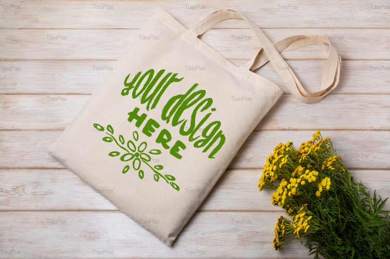 rustic-tote-bag-mockup-with-yellow-wildflowers