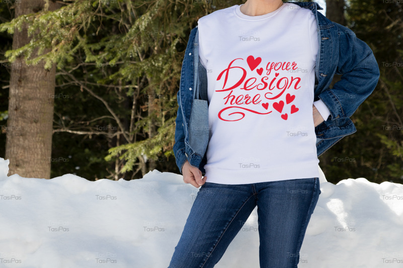 white-sweatshirt-mockup-of-a-girl-in-snowy-winter-forest-model-mocku