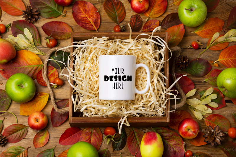 white-coffee-mug-mockup-with-fall-leave-and-pine-cones