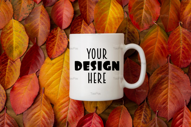 white-coffee-mug-mockup-with-red-yellow-fall-leaves