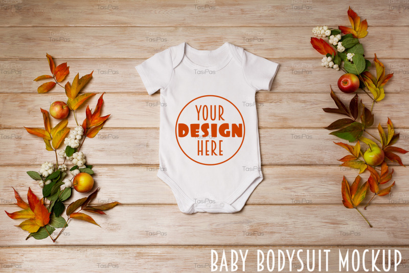 white-baby-short-sleeve-bodysuit-mockup-with-snowberry-and-fall-leaves