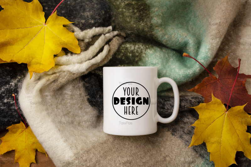 white-coffee-mug-mockup-with-woolen-scarf-and-fall-maple-leaves