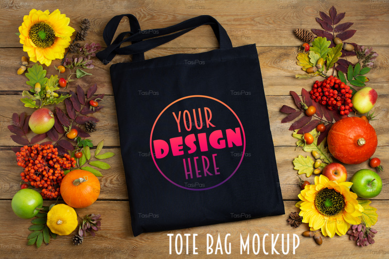 black-tote-bag-mockup-with-sunflowers-and-rowanberry