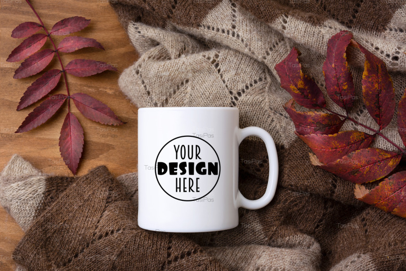 white-coffee-mug-mockup-with-knitted-blanket-and-red-fall-leaves
