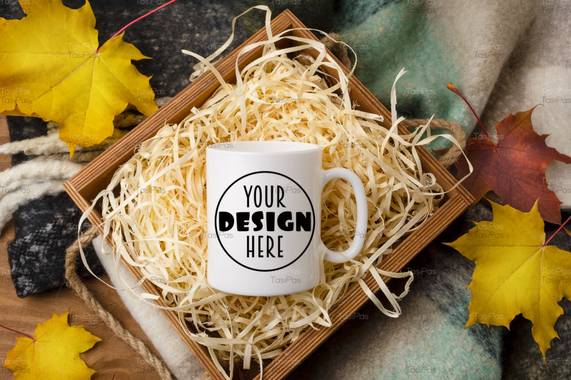 white-coffee-mug-mockup-with-gift-box-and-maple-leaves
