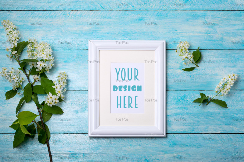 white-small-frame-mockup-with-bird-cherry-on-the-blue