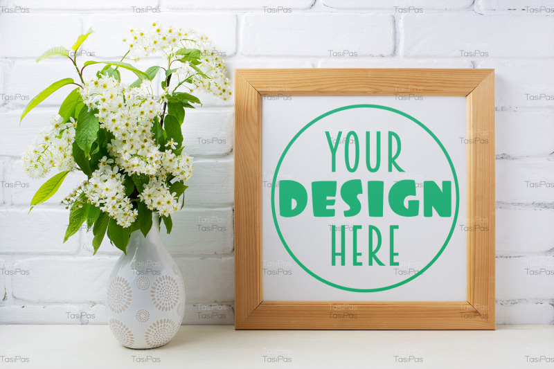 square-wooden-picture-frame-mockup-with-bird-cherry-bouquet