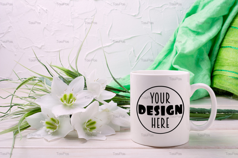 white-coffee-mug-mockup-with-lily-and-green-scarf