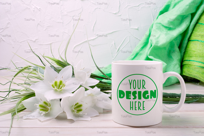 white-coffee-mug-mockup-with-lily-and-green-scarf