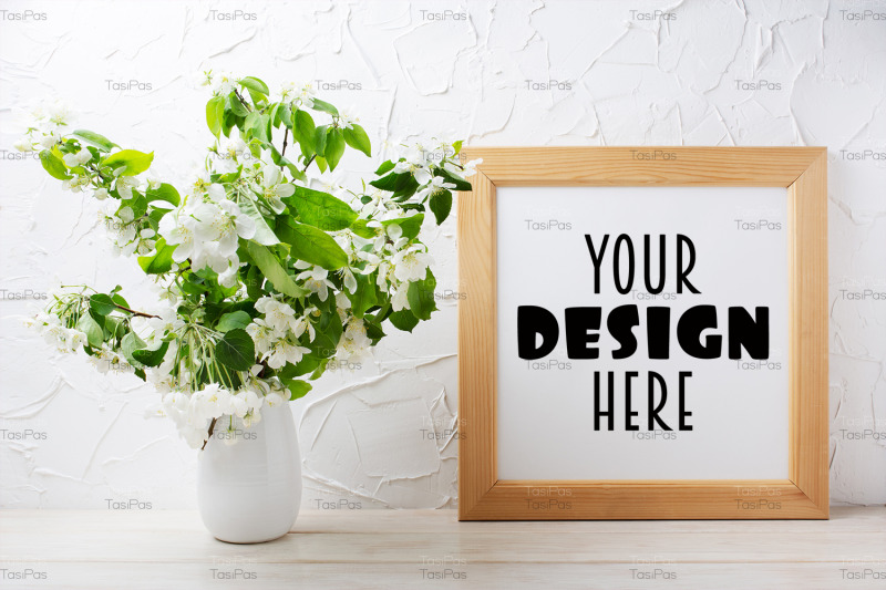 square-wooden-picture-frame-mockup-with-tender-apple-blossom