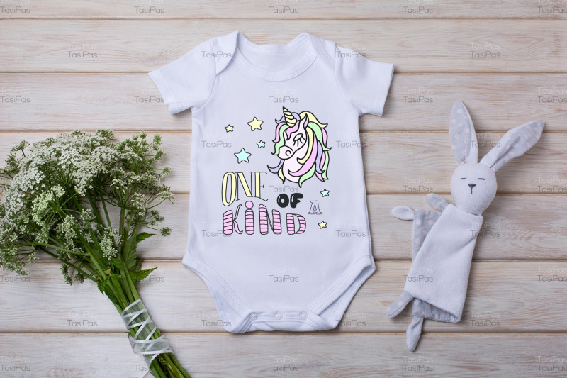 white-baby-short-sleeve-bodysuit-mockup-with-wild-flowers-and-bunny-ra