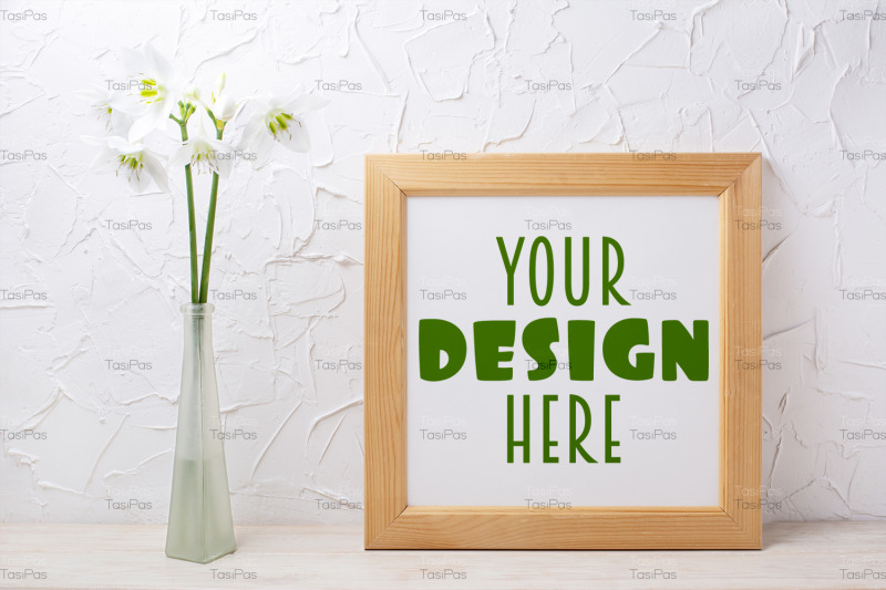 square-wooden-picture-frame-mockup-with-lily-in-the-glass-vase