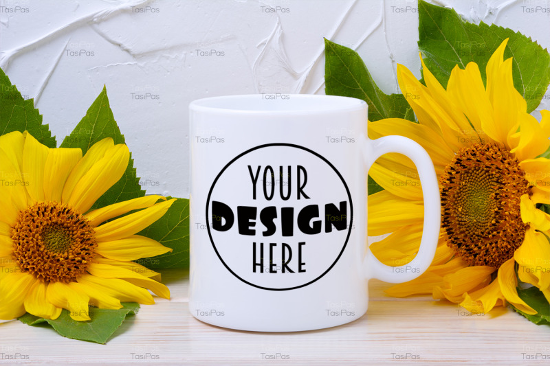 white-coffee-mug-mockup-with-two-yellow-sunflowers