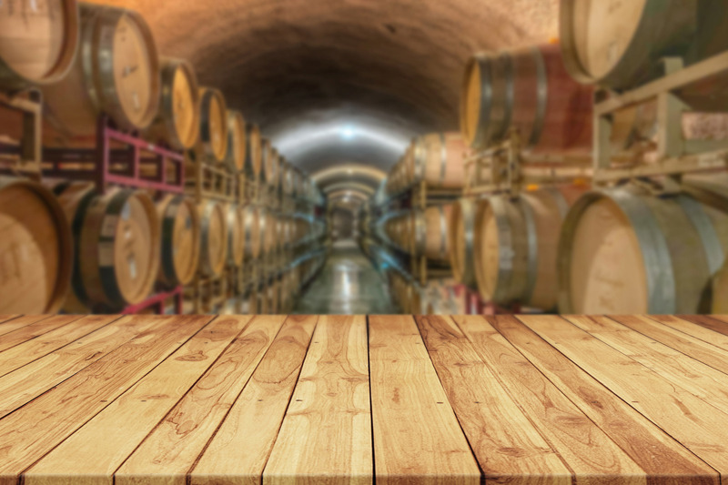 empty-table-old-rustic-wood-plank-with-blurred-old-wine-cellar