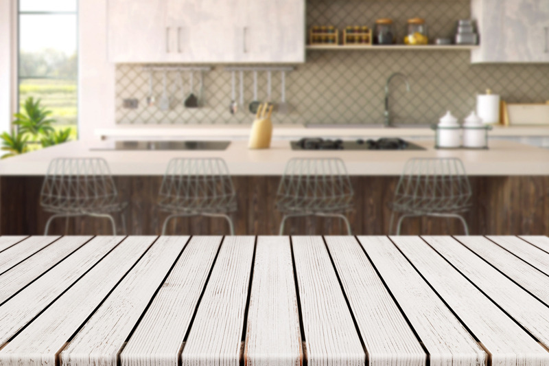 empty-white-wood-plank-table-with-blurred-kitchen-background
