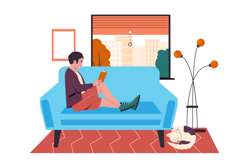 man-reading-book-on-couch-at-home