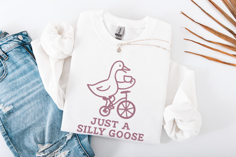 just-a-silly-goose-png-funny-goose-drinking-tea-on-bicycle-whimsical