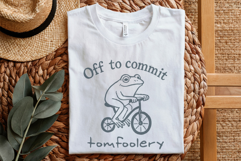 off-to-commit-tomfoolery-funny-frog-on-bicycle-whimsical-animal-humor
