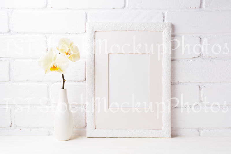 white-frame-mockup-with-soft-yellow-orchid-in-vase