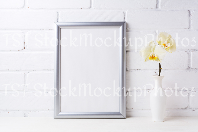 silver-frame-mockup-with-soft-yellow-orchid-in-vase