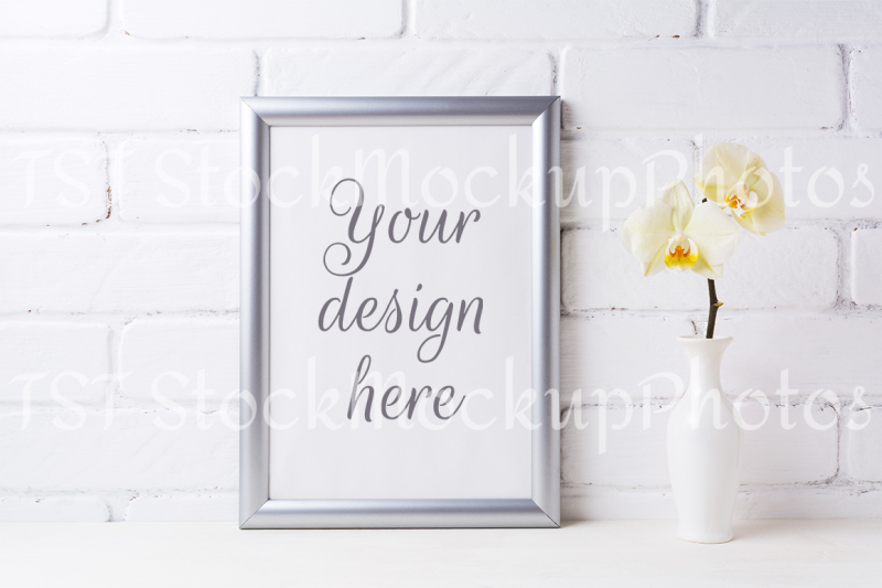 silver-frame-mockup-with-soft-yellow-orchid-in-vase