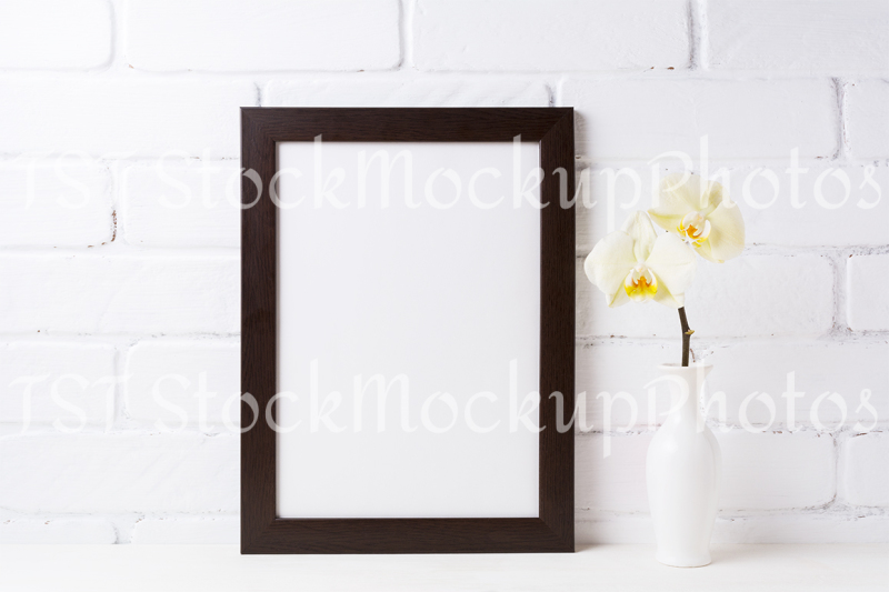 black-brown-frame-mockup-with-soft-yellow-orchid-in-vase