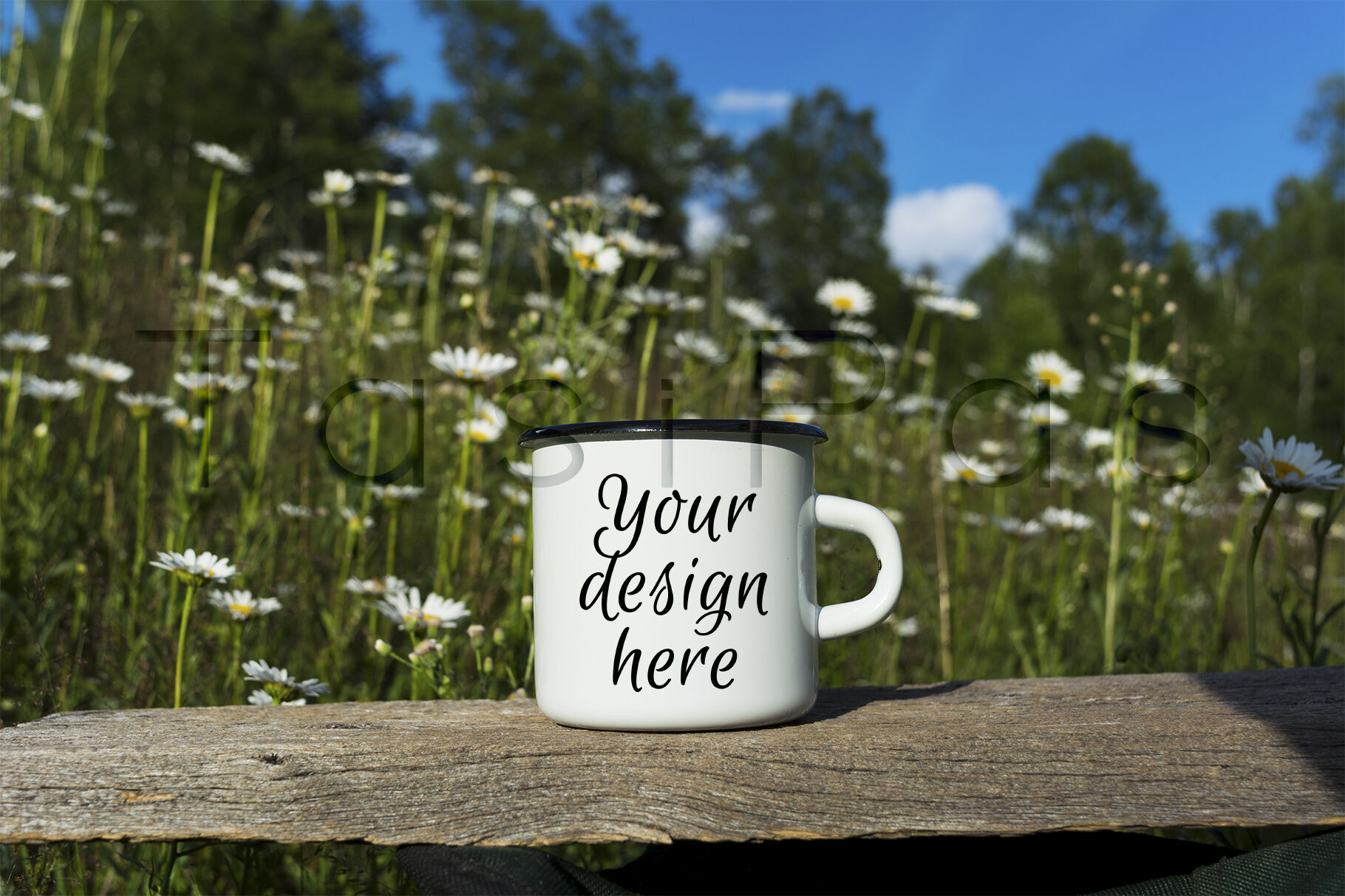 White campfire enamel mug mockup with daisy field. By ...